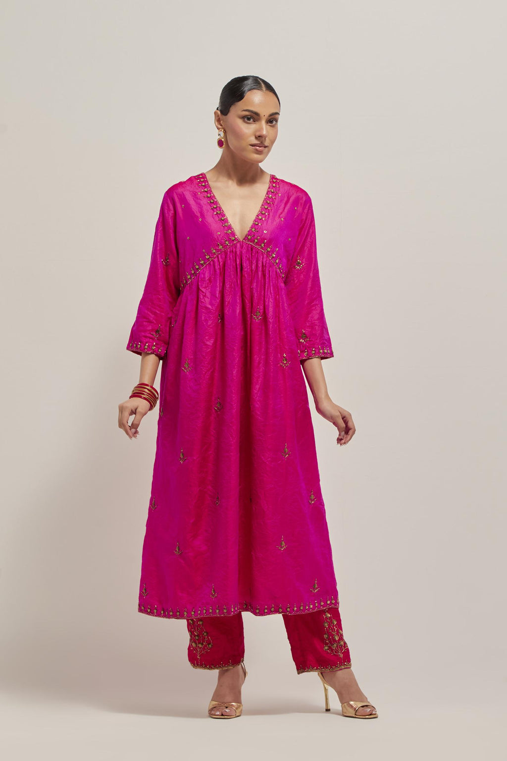 Fuchsia double toned silk kurta set with hand embroidered zardozi and sequins, highlighted with beads.