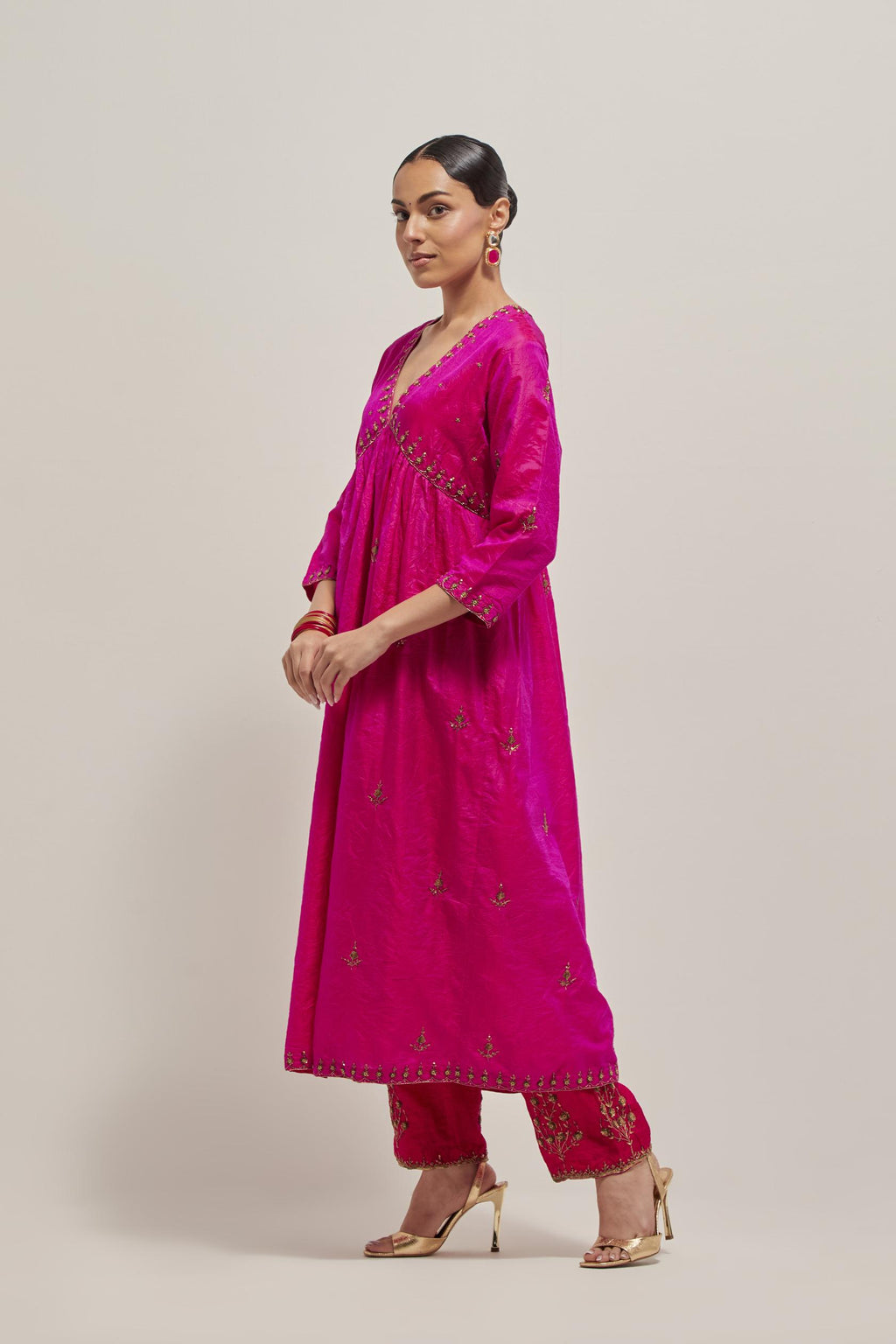 Fuchsia double toned silk kurta set with hand embroidered zardozi and sequins, highlighted with beads.