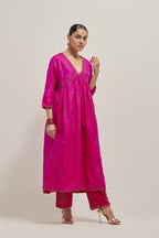 Fuchsia double toned silk kurta set with hand embroidered zardozi and sequins, highlighted with beads.