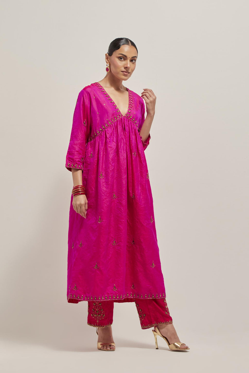 Fuchsia double toned silk kurta set with hand embroidered zardozi and sequins, highlighted with beads.