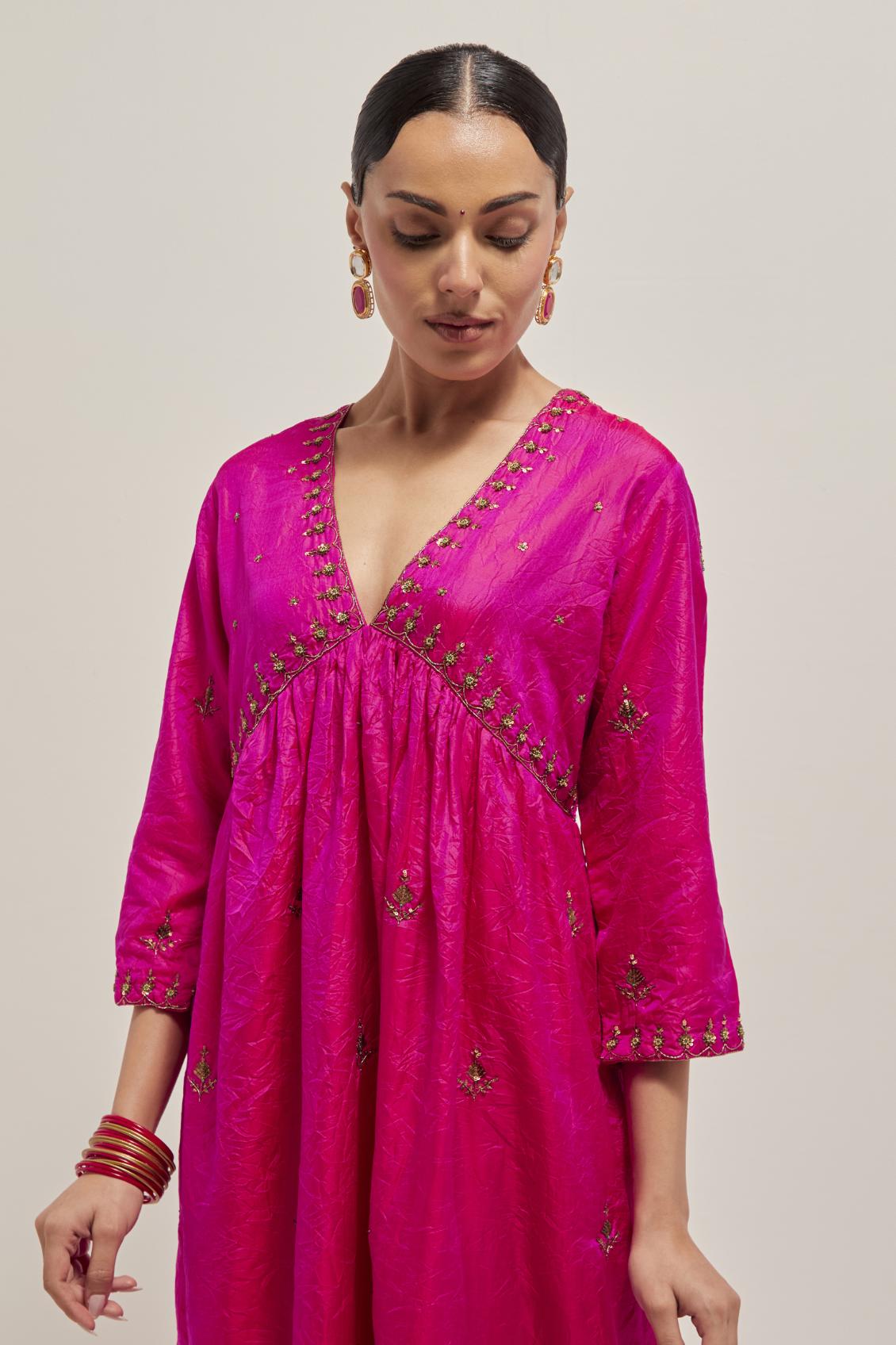 Fuchsia double toned silk kurta set with hand embroidered zardozi and sequins, highlighted with beads.