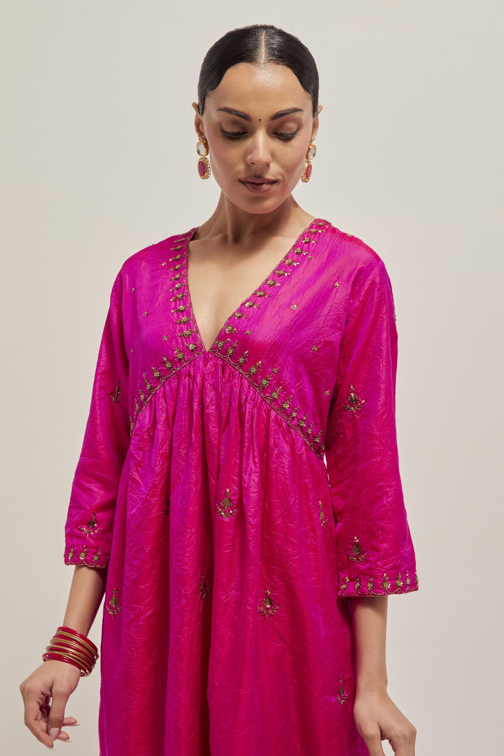 Fuchsia double toned silk kurta set with hand embroidered zardozi and sequins, highlighted with beads.