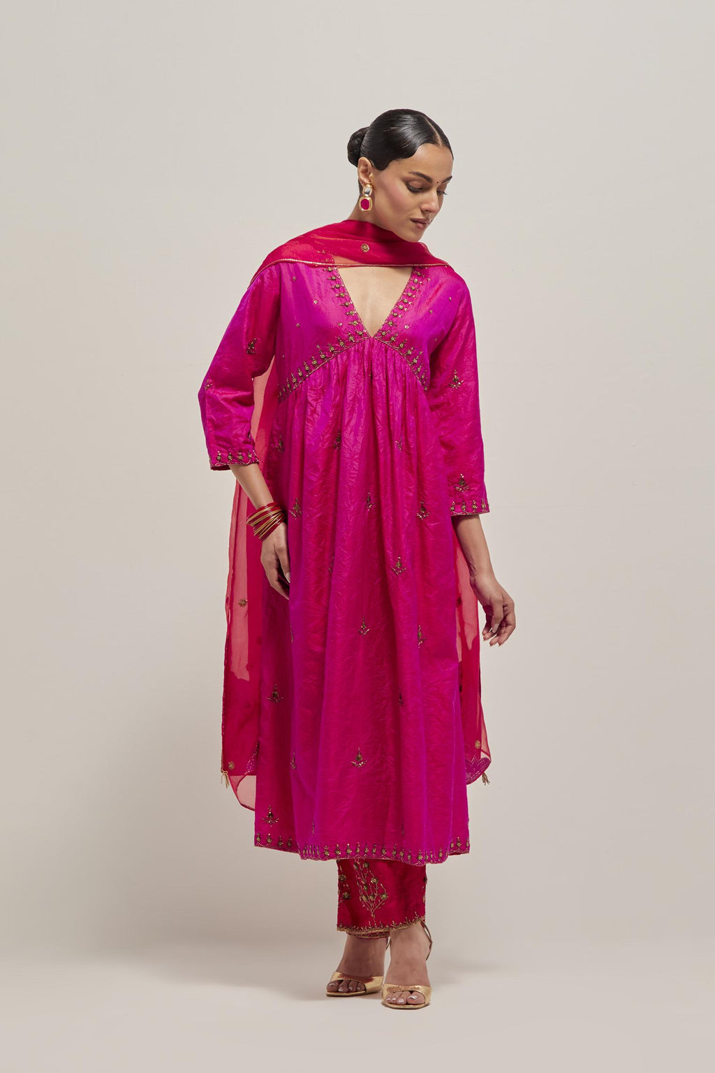 Fuchsia double toned silk kurta set with hand embroidered zardozi and sequins, highlighted with beads.