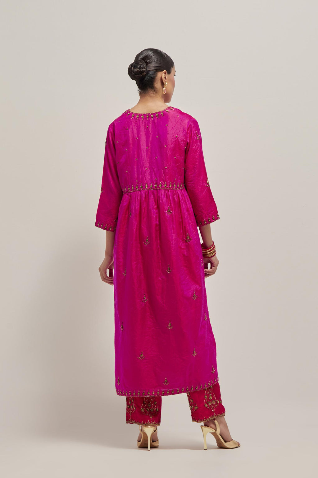 Fuchsia double toned silk kurta set with hand embroidered zardozi and sequins, highlighted with beads.