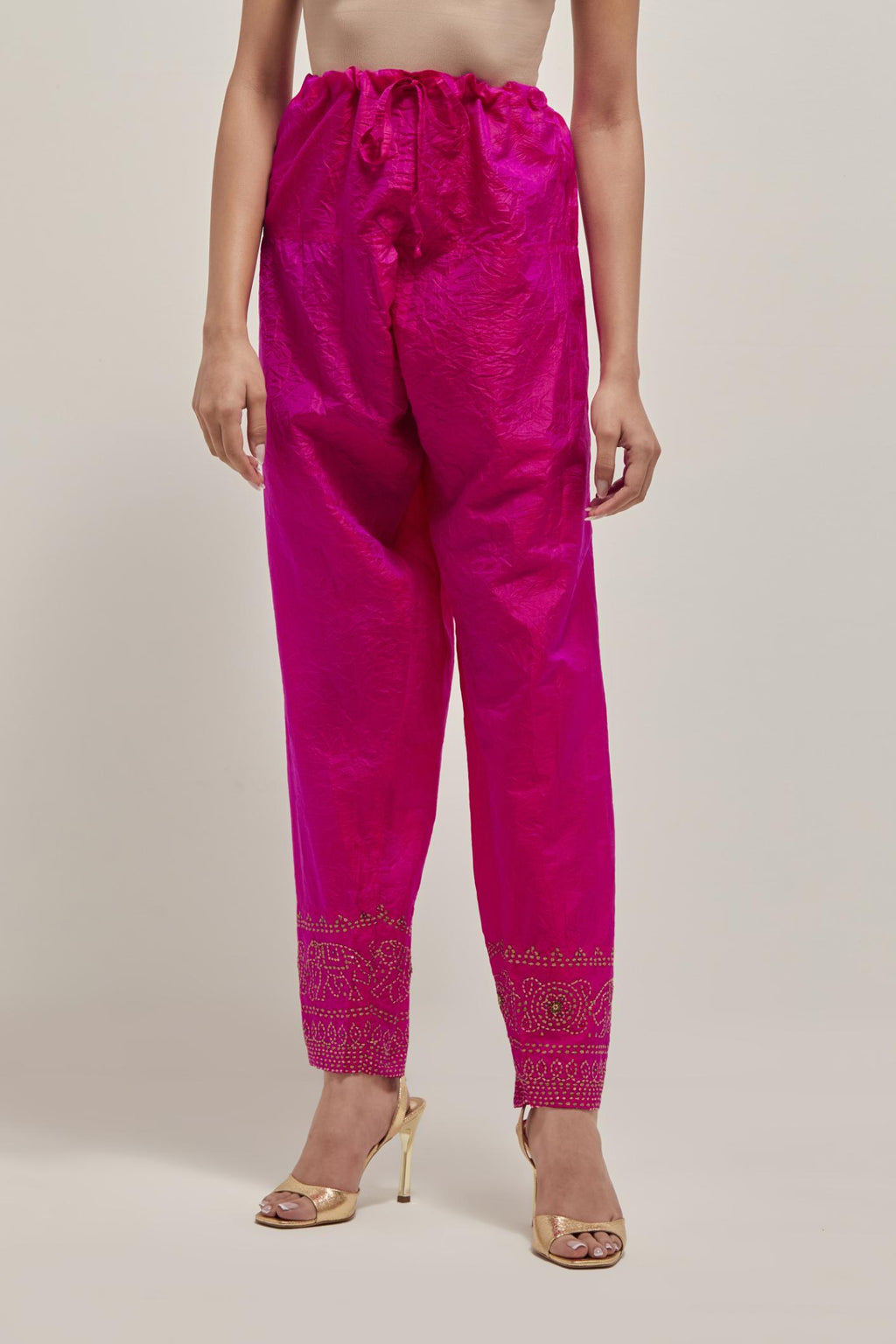 Fuchsia silk narrow salwar with a broad bandhani-inspired border at the hem, detailed with delicate bead and sequin work.