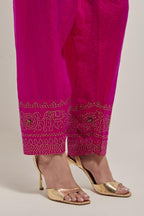 Fuchsia silk narrow salwar with a broad bandhani-inspired border at the hem, detailed with delicate bead and sequin work.