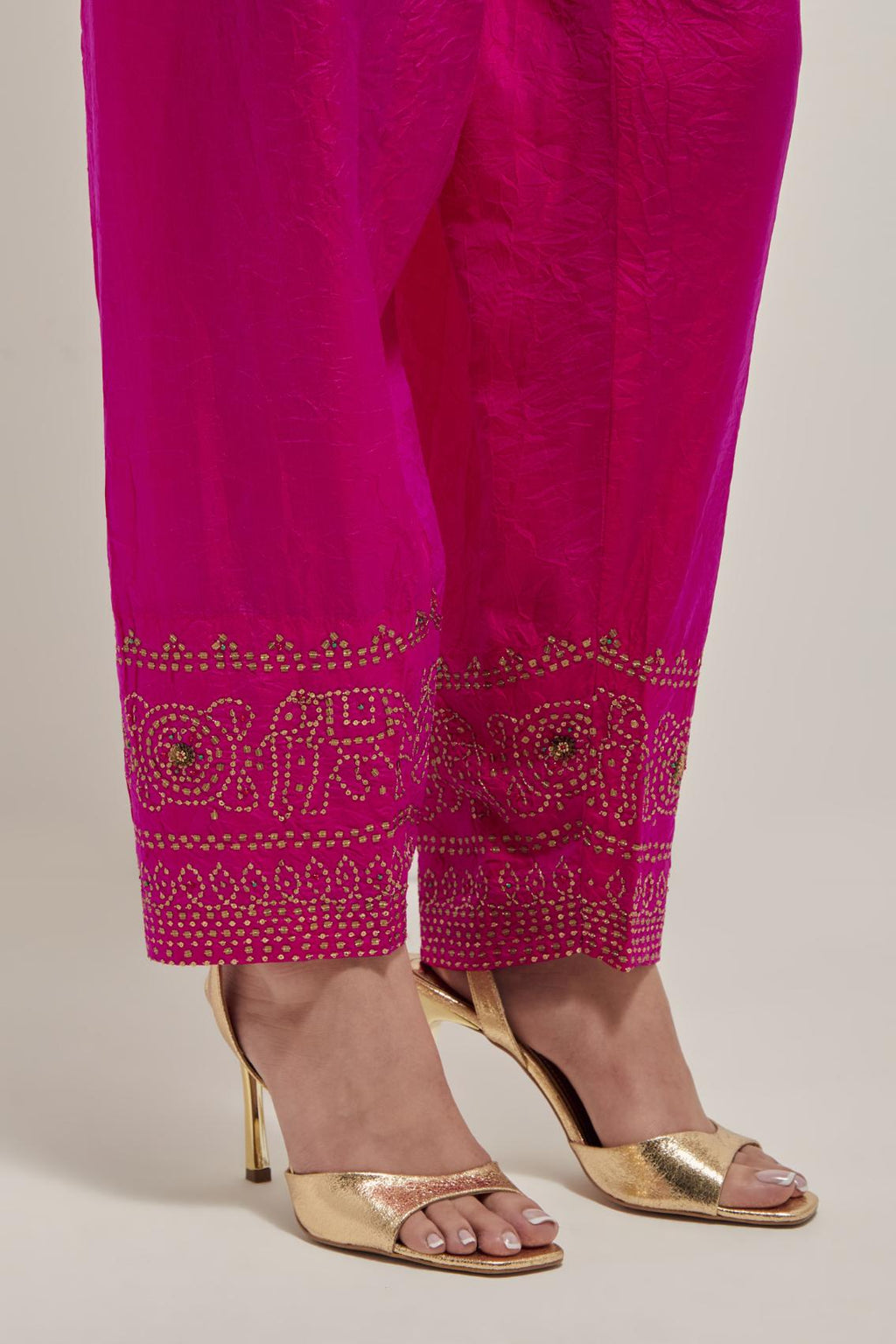 Fuchsia silk narrow salwar with a broad bandhani-inspired border at the hem, detailed with delicate bead and sequin work.