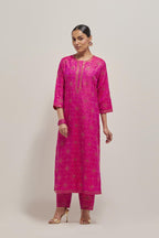 Fuchsia silk straight kurta set with hand embroidered sequins on bandhani inspired floral jaal all-over the kurta, highlighted with contrast-colored beads.