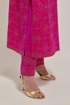 Fuchsia silk straight kurta set with hand embroidered sequins on bandhani inspired floral jaal all-over the kurta, highlighted with contrast-colored beads.