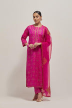 Fuchsia silk straight kurta set with hand embroidered sequins on bandhani inspired floral jaal all-over the kurta, highlighted with contrast-colored beads.