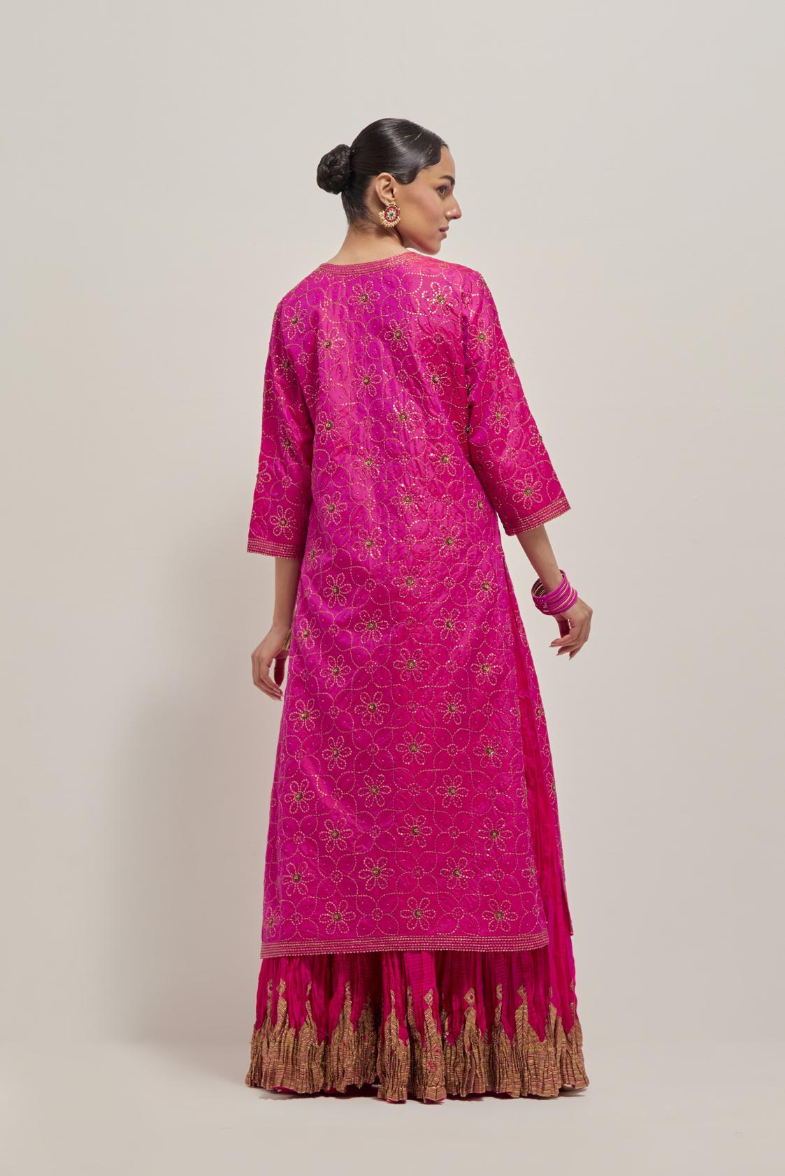 Fuchsia silk straight kurta set with hand embroidered sequins on bandhani inspired floral jaal all-over the kurta, highlighted with contrast-colored beads.