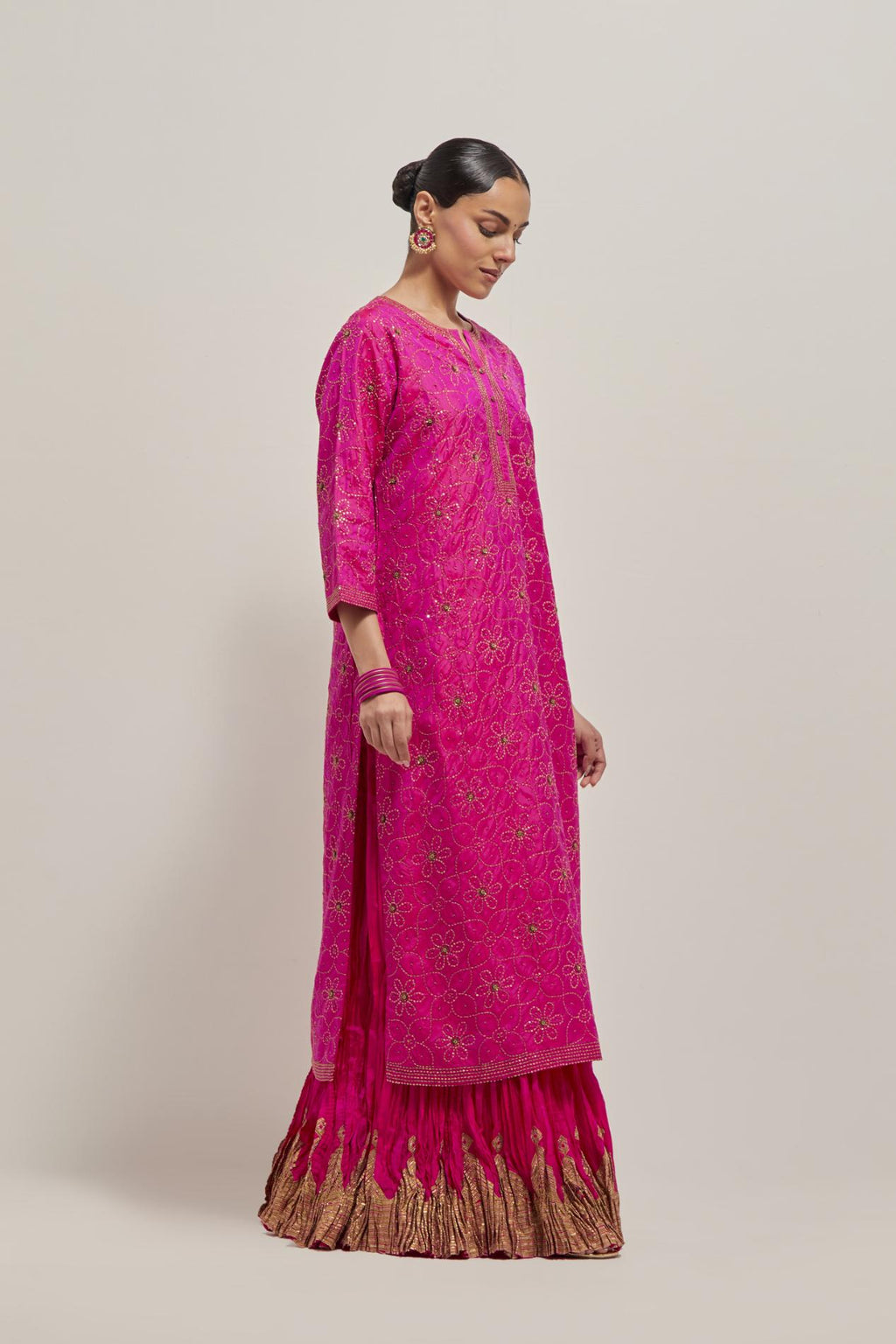 Fuchsia silk straight kurta set with hand embroidered sequins on bandhani inspired floral jaal all-over the kurta, highlighted with contrast-colored beads.