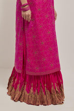 Fuchsia silk straight kurta set with hand embroidered sequins on bandhani inspired floral jaal all-over the kurta, highlighted with contrast-colored beads.