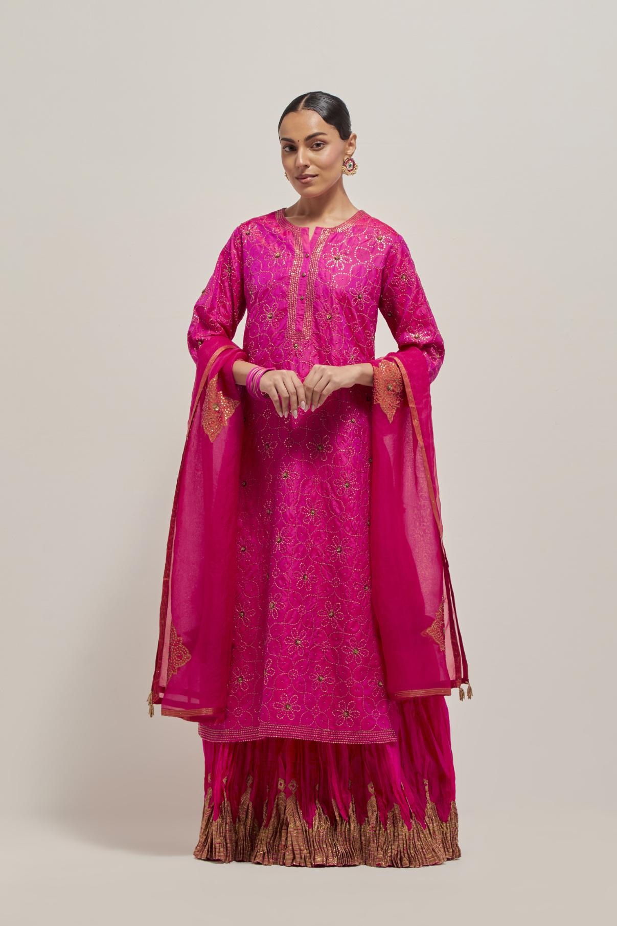 Fuchsia silk straight kurta set with hand embroidered sequins on bandhani inspired floral jaal all-over the kurta, highlighted with contrast-colored beads.