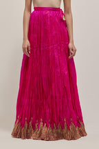 Fuchsia Silk 40 kali lehenga edged with dull gold gota embroidery and contrast silk facings.