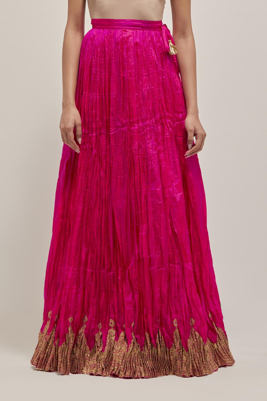 Fuchsia Silk 40 kali lehenga edged with dull gold gota embroidery and contrast silk facings.