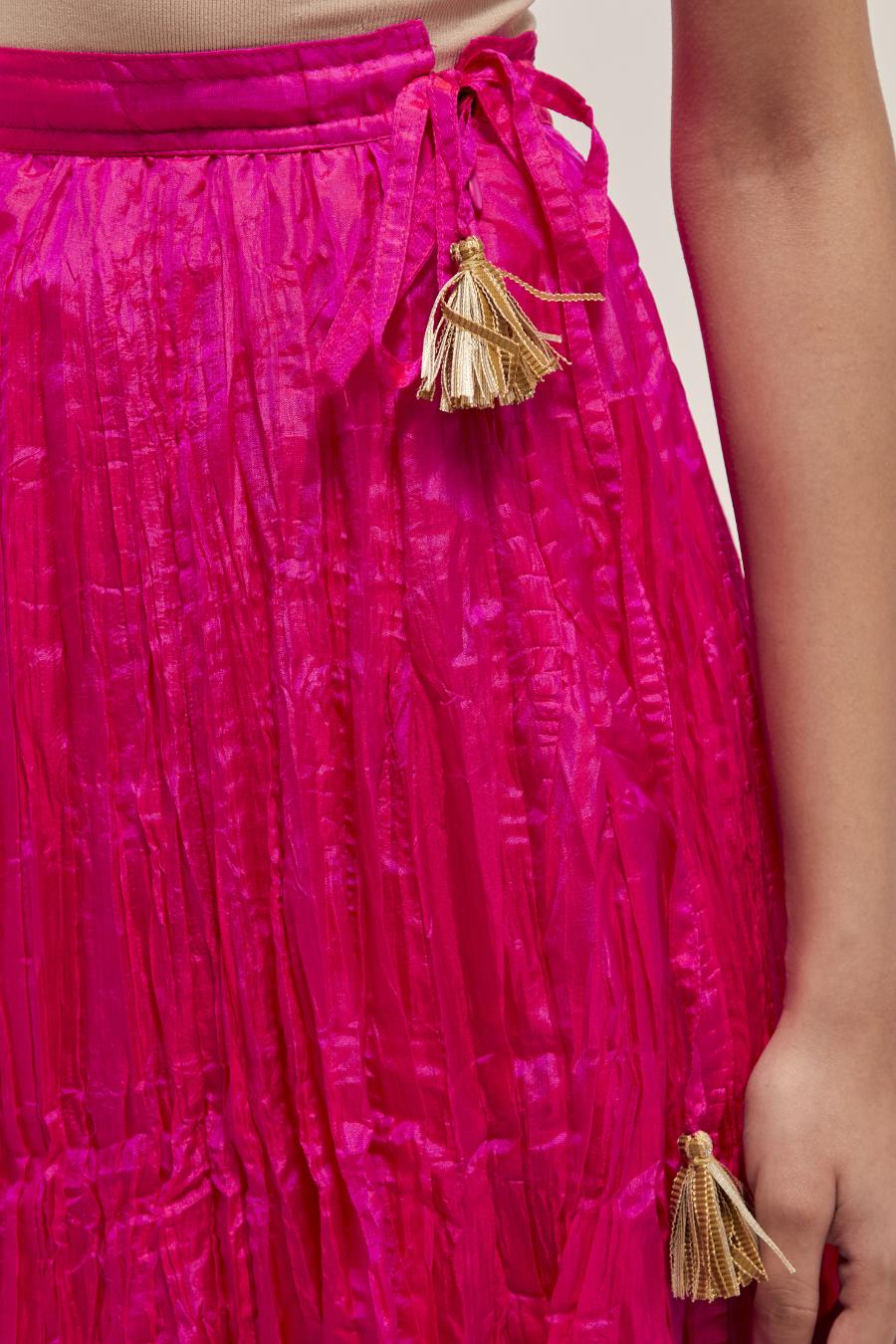 Fuchsia Silk 40 kali lehenga edged with dull gold gota embroidery and contrast silk facings.