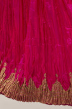 Fuchsia Silk 40 kali lehenga edged with dull gold gota embroidery and contrast silk facings.