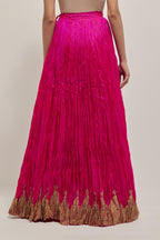 Fuchsia Silk 40 kali lehenga edged with dull gold gota embroidery and contrast silk facings.