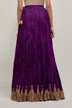 Purple Silk 40 kali lehenga edged with dull gold gota embroidery and contrast silk facings.