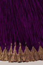 Purple Silk 40 kali lehenga edged with dull gold gota embroidery and contrast silk facings.