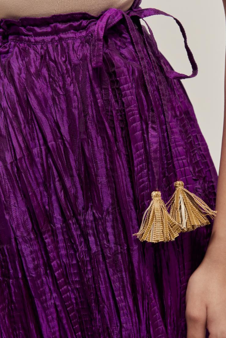 Purple Silk 40 kali lehenga edged with dull gold gota embroidery and contrast silk facings.