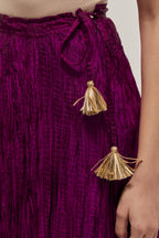 Wine Silk 40 kali lehenga edged with dull gold gota embroidery and contrast silk facings.