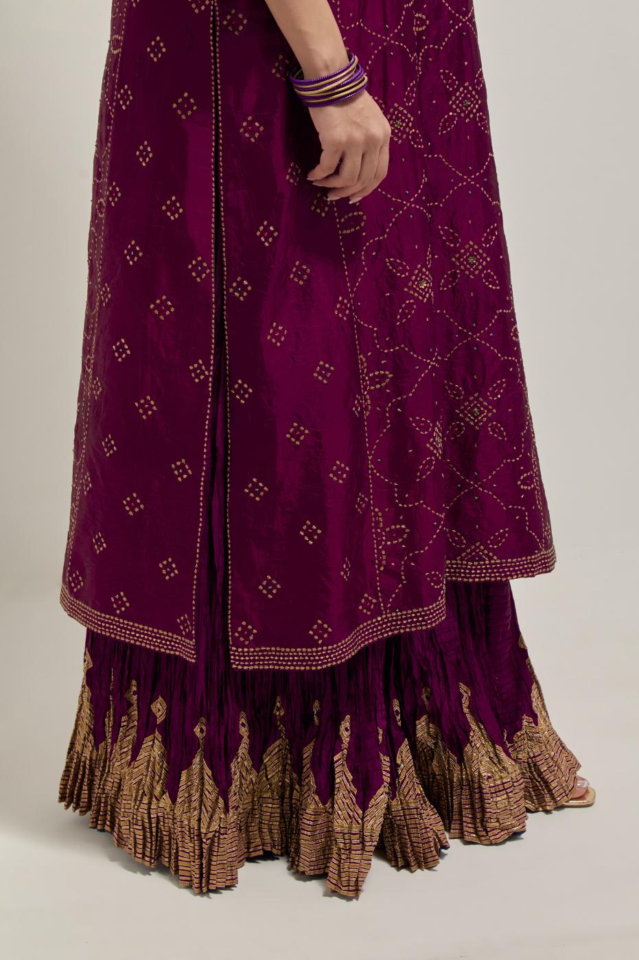 Wine Silk kurta set with all-over hand embroidered sequins on bandhani inspired floral jaal and small square booti at side panels, highlighted with contrast-colored beads.