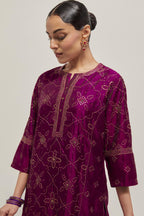 Wine Silk kurta set with all-over hand embroidered sequins on bandhani inspired floral jaal and small square booti at side panels, highlighted with contrast-colored beads.