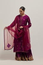 Wine Silk kurta set with all-over hand embroidered sequins on bandhani inspired floral jaal and small square booti at side panels, highlighted with contrast-colored beads.