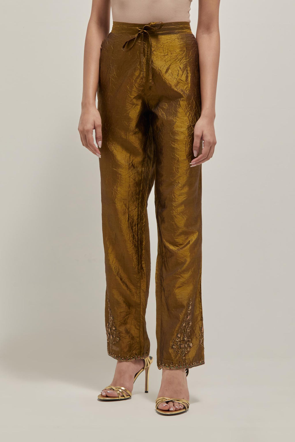 Olive Silk pants, highlighted with hand embroidered bead, sequins and zardozi boota at hem, highlighted with contrast bead work.
