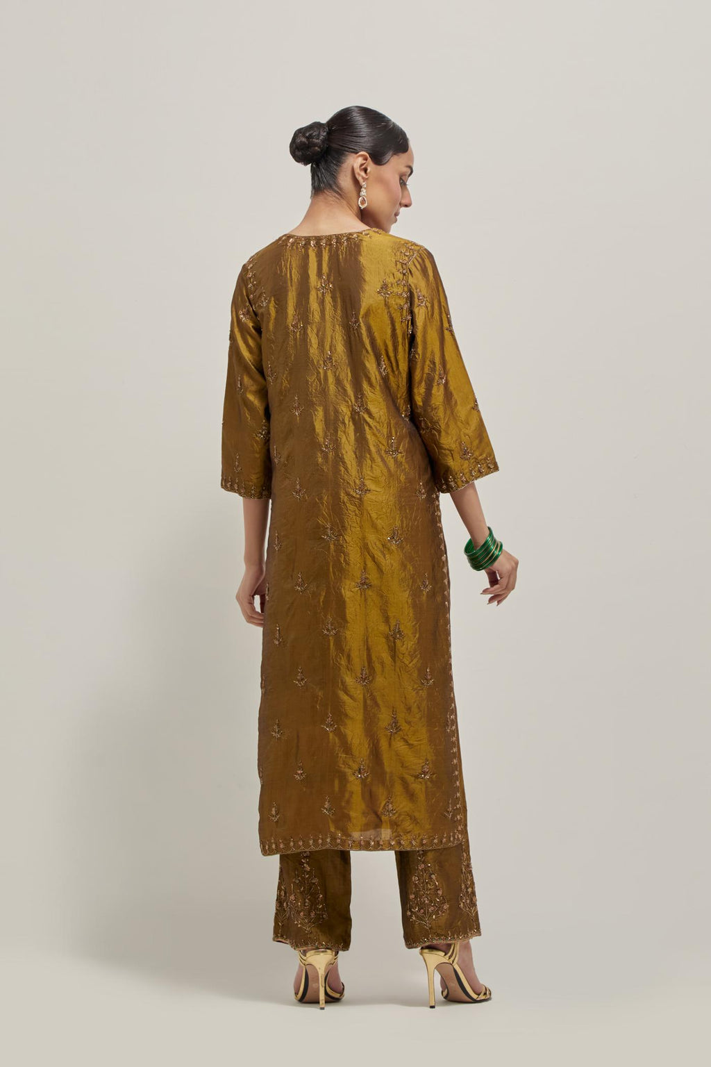 Olive double toned silk straight kurta set with all-over hand embroidered zardozi and sequins work, highlighted with beads.