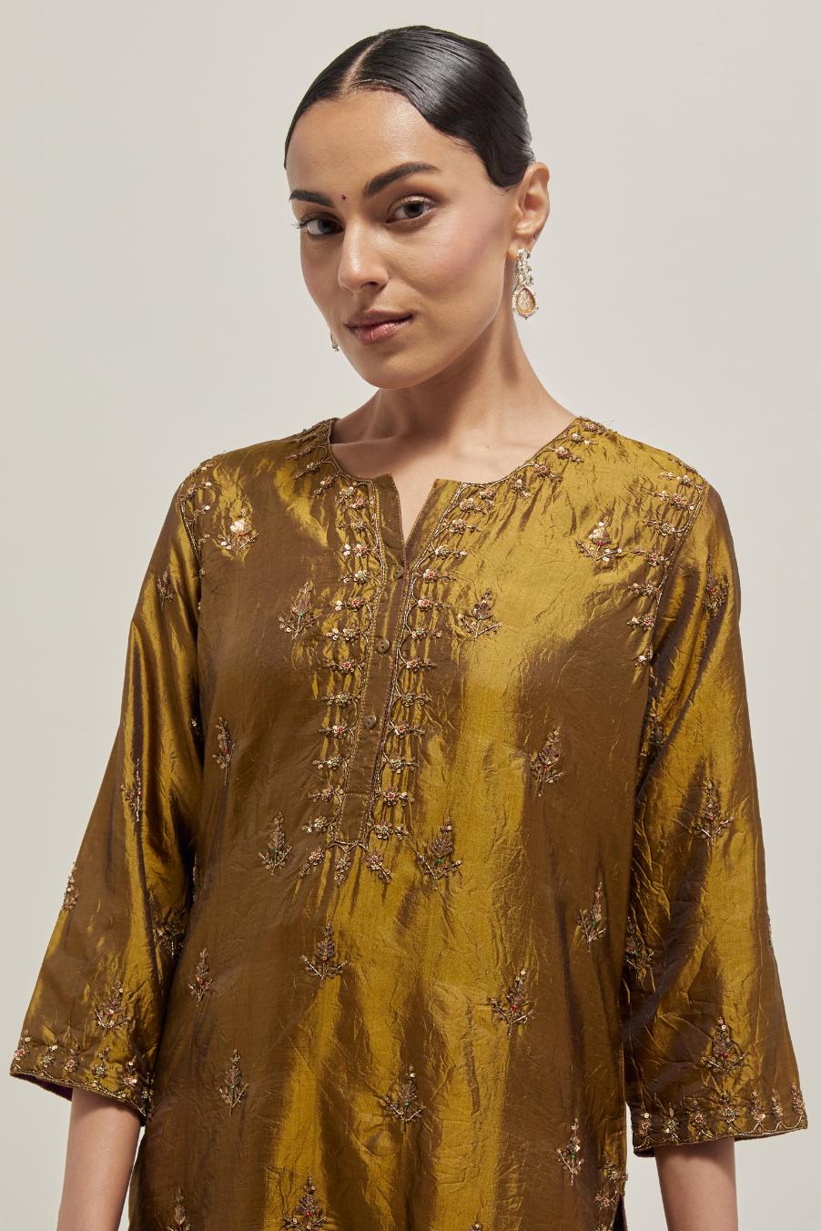 Olive double toned silk straight kurta set with all-over hand embroidered zardozi and sequins work, highlighted with beads.