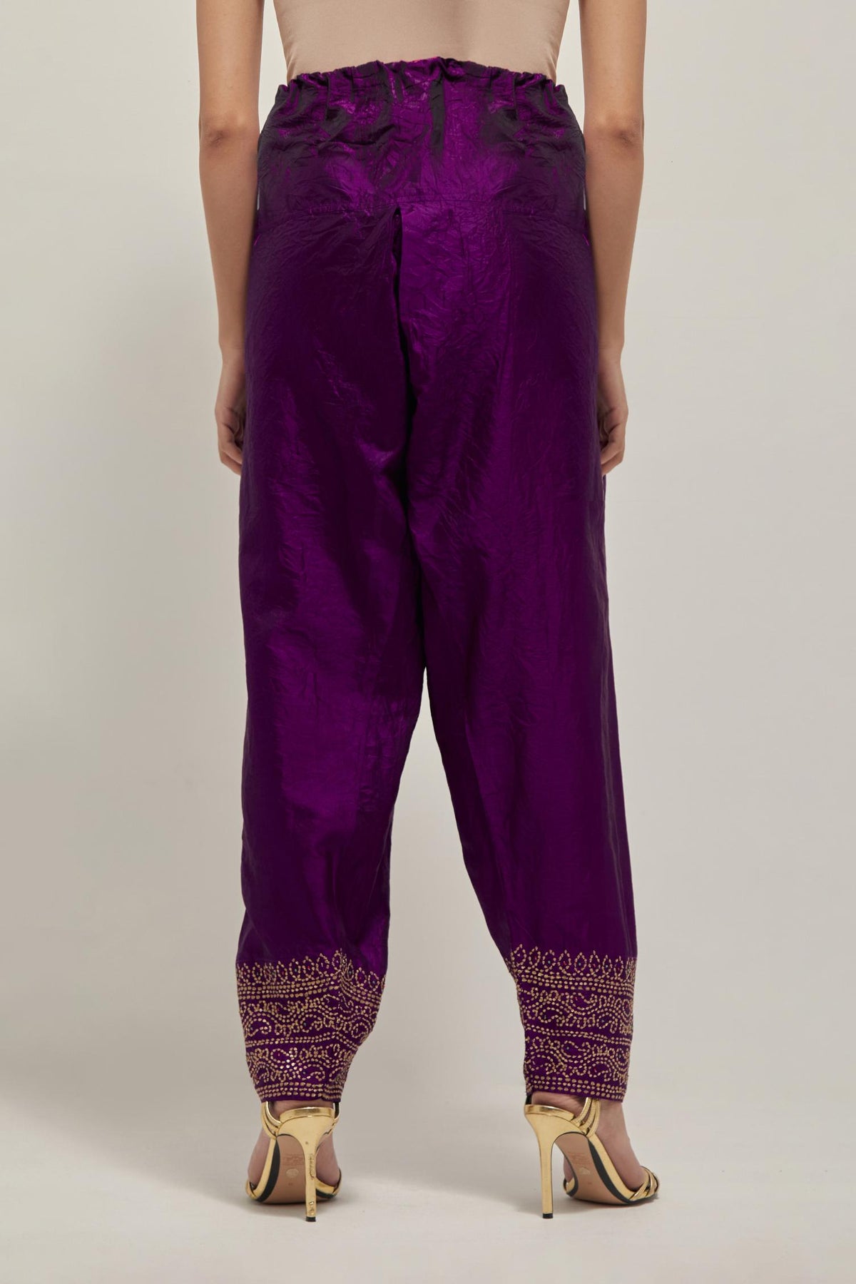 Purple silk narrow salwar with a broad bandhani-inspired border at the hem, detailed with delicate bead and sequin work.