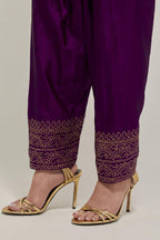 Purple silk narrow salwar with a broad bandhani-inspired border at the hem, detailed with delicate bead and sequin work.