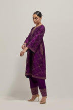 Purple silk A-line kurta set with hand embroidered sequins on bandhani inspired jaal all-over the kurta, highlighted with contrast-colored beads.