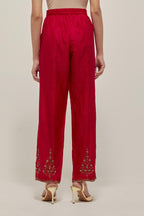 Red Silk pants, highlighted with hand embroidered bead, sequins and zardozi boota at hem, highlighted with contrast bead work.