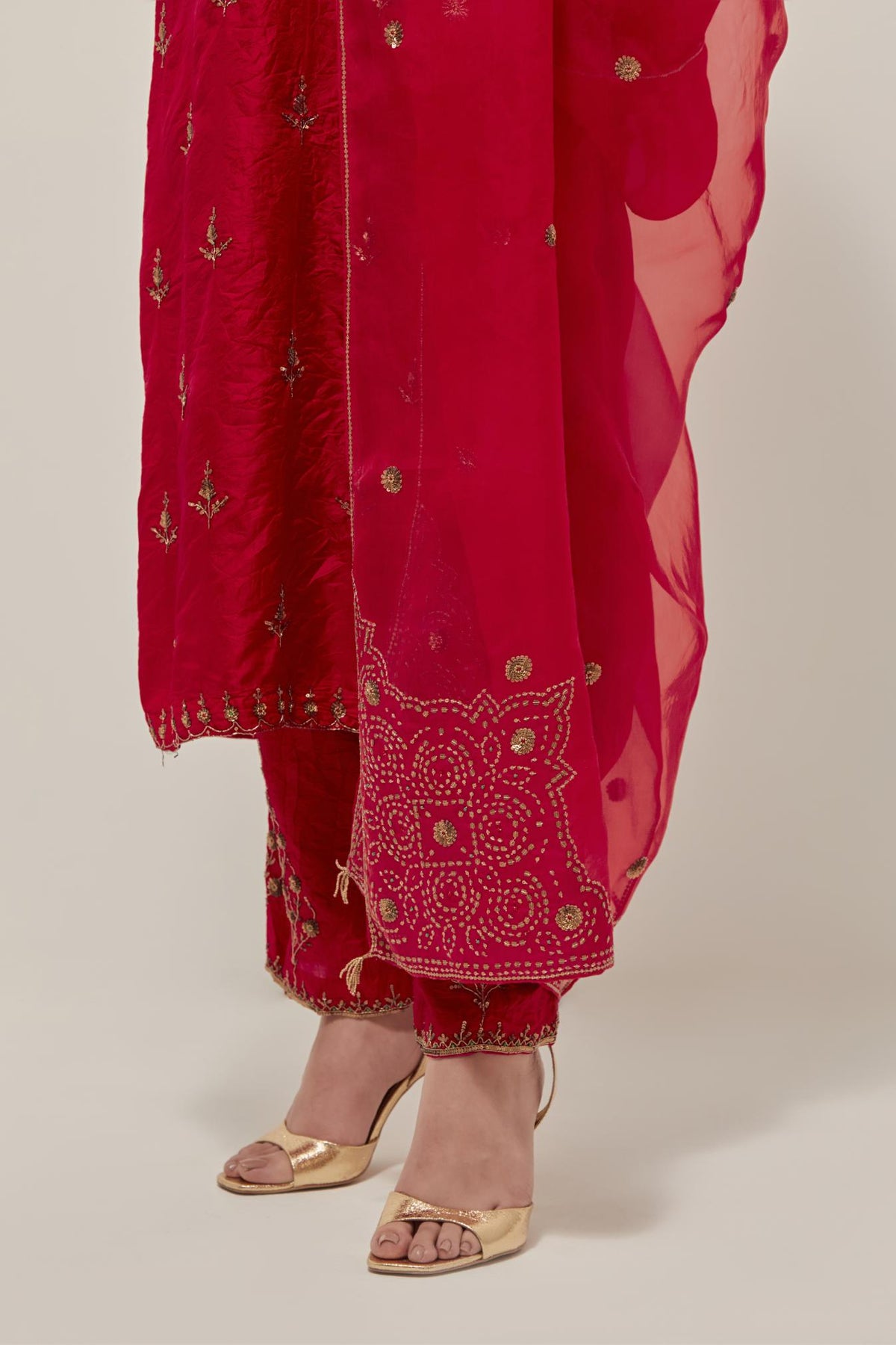 Red silk organza dupatta with all-over delicate sequins and bead small booti, finished with applique bandhani-inspired motifs at all four corners.