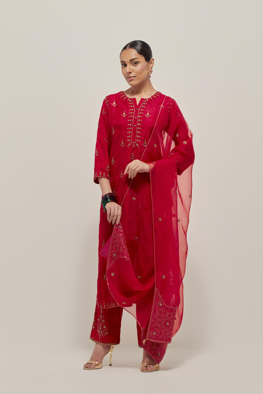 Red silk organza dupatta with all-over delicate sequins and bead small booti, finished with applique bandhani-inspired motifs at all four corners.