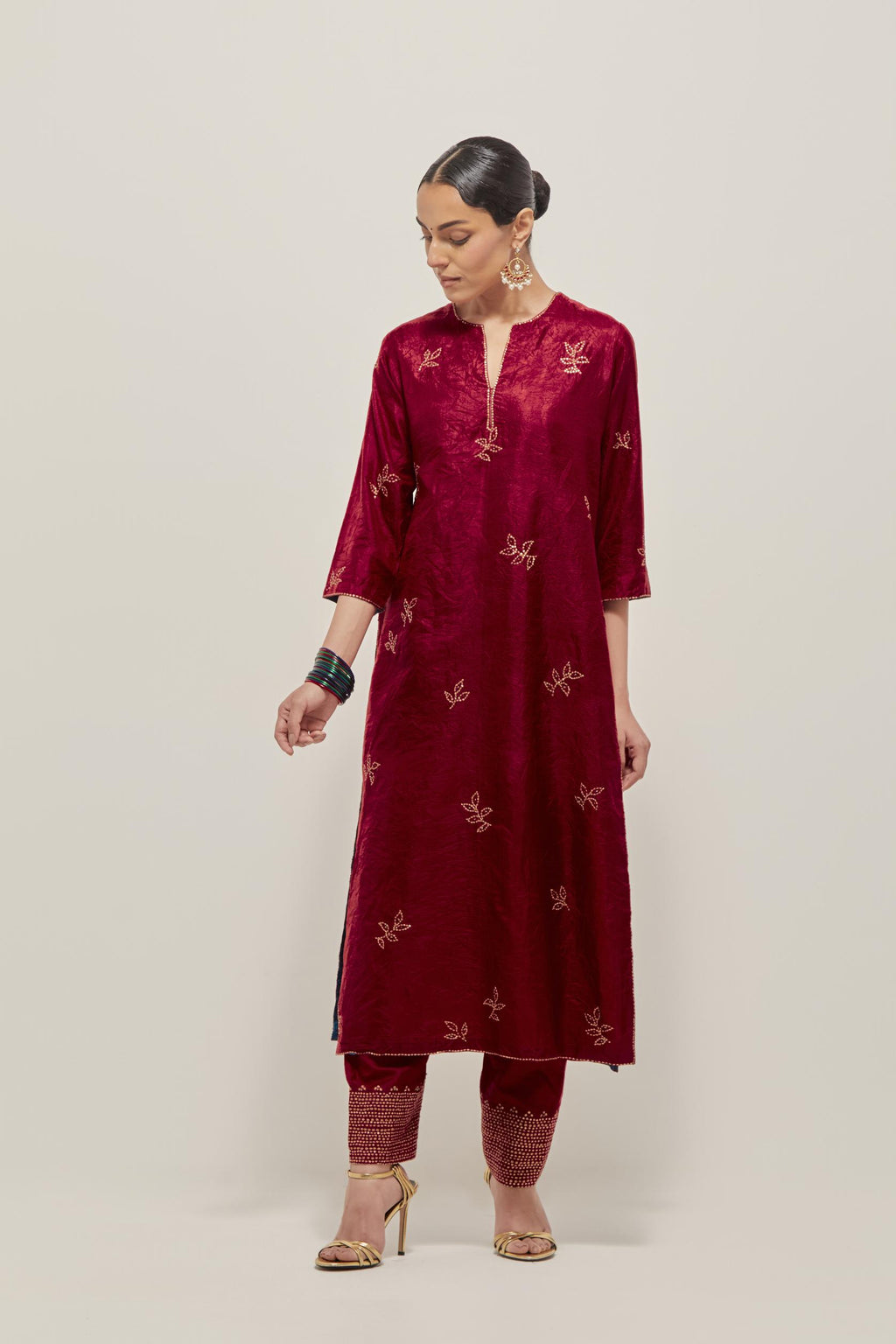 Red Silk kurta set with hand embroidered sequins on bandhani inspired floral motif all-over the kurta, highlighted with contrast-colored beads.