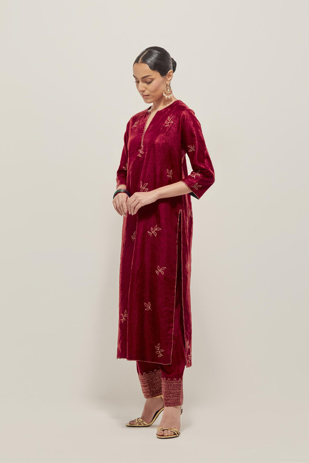 Red Silk kurta set with hand embroidered sequins on bandhani inspired floral motif all-over the kurta, highlighted with contrast-colored beads.