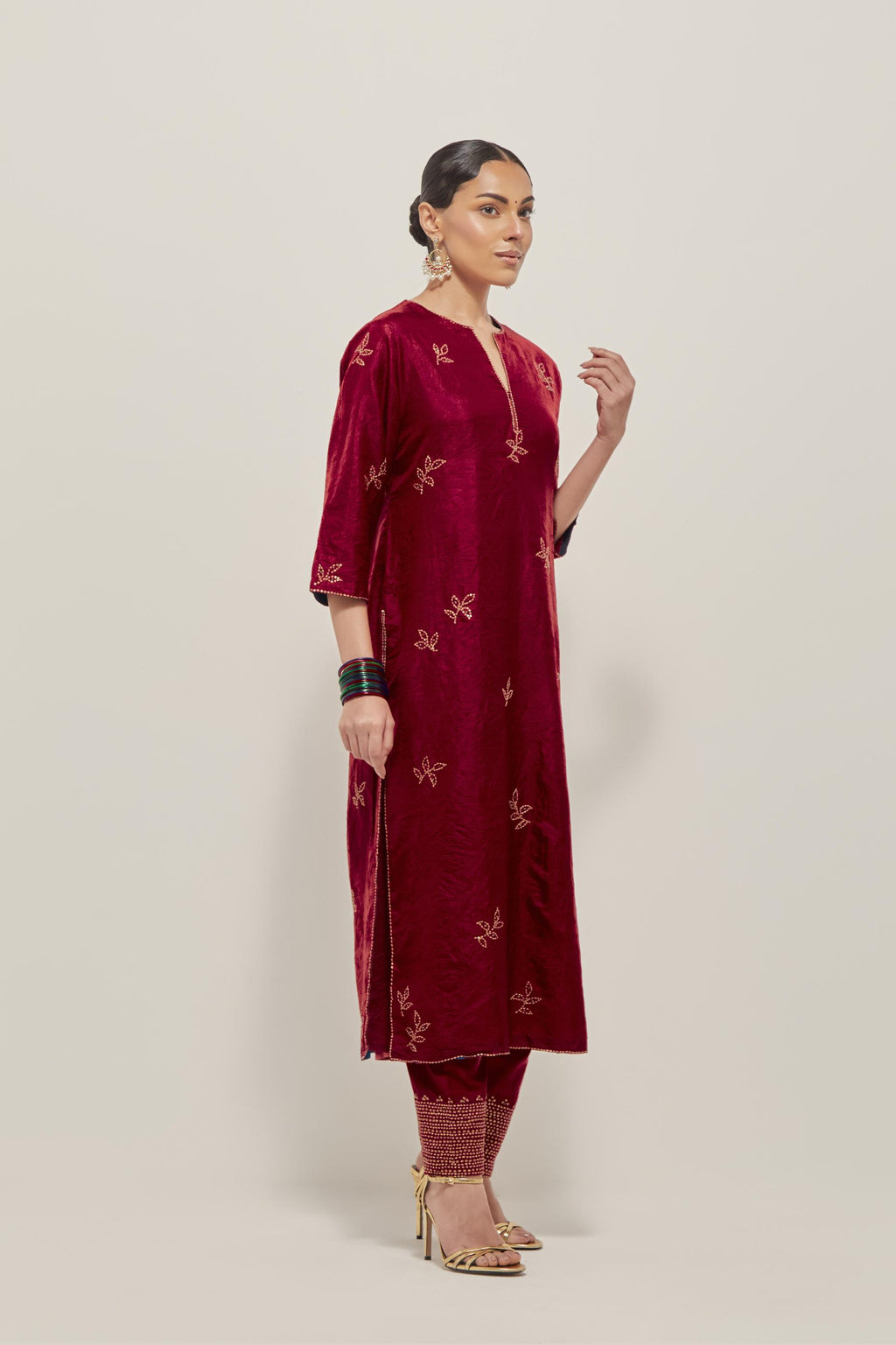 Red Silk kurta set with hand embroidered sequins on bandhani inspired floral motif all-over the kurta, highlighted with contrast-colored beads.
