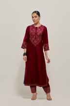 Red Silk kurta set with hand embroidered sequins on bandhani inspired jaal work at neck, hem and sleeves cuff, highlighted with contrast-colored beads.