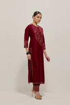 Red Silk kurta set with hand embroidered sequins on bandhani inspired jaal work at neck, hem and sleeves cuff, highlighted with contrast-colored beads.