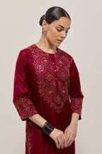 Red Silk kurta set with hand embroidered sequins on bandhani inspired jaal work at neck, hem and sleeves cuff, highlighted with contrast-colored beads.
