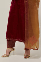 Red Silk kurta set with hand embroidered sequins on bandhani inspired jaal work at neck, hem and sleeves cuff, highlighted with contrast-colored beads.