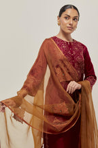 Red Silk kurta set with hand embroidered sequins on bandhani inspired jaal work at neck, hem and sleeves cuff, highlighted with contrast-colored beads.