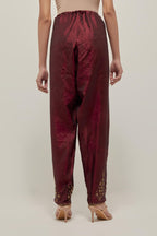 Maroon Silk salwar, highlighted with hand embroidered bead, sequins and zardozi boota at hem, highlighted with contrast bead work.