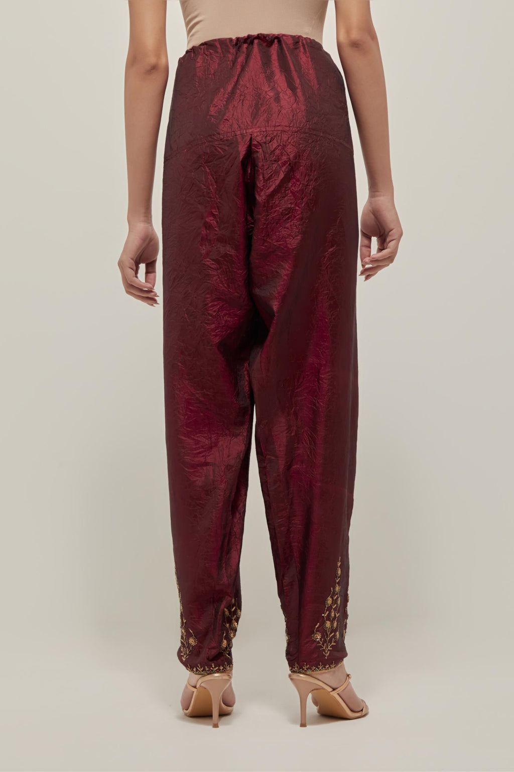 Maroon Silk salwar, highlighted with hand embroidered bead, sequins and zardozi boota at hem, highlighted with contrast bead work.