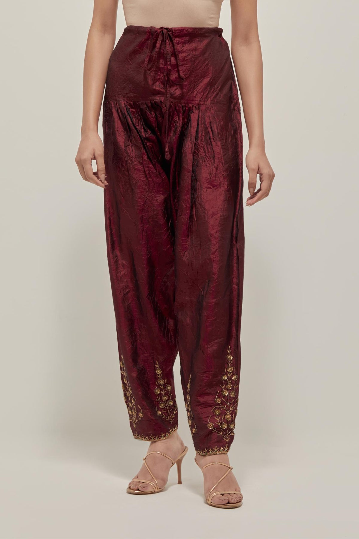 Maroon Silk salwar, highlighted with hand embroidered bead, sequins and zardozi boota at hem, highlighted with contrast bead work.